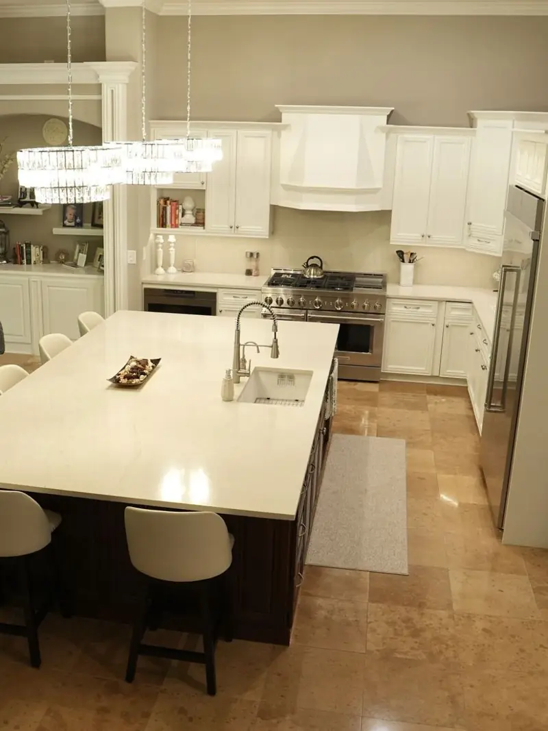 White kitchen cabinetry with a large island