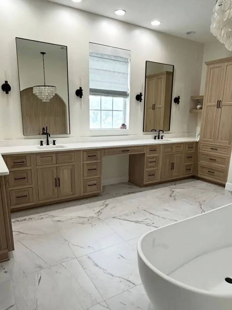 Large-format marble-look tile in a primary bathroom